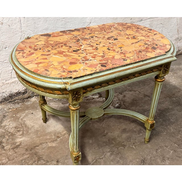 This exquisite French side table, dating to the turn of the 20th century, captures the stately grandeur of the Louis XIV...