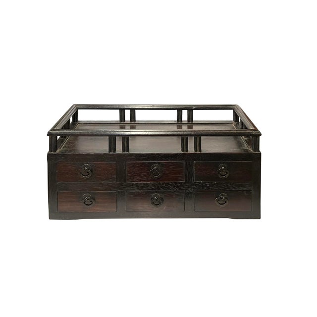 This is a handmade Chinese accent decorative display stand chest made of wood with small drawers. Dimensions: w17.75" x...