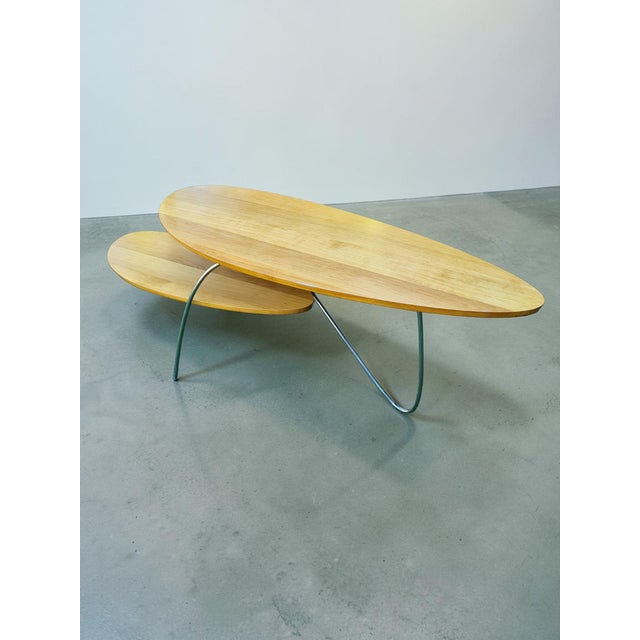 An elegant coffee table with a light, modern form inspired by late 20th-century Scandinavian design. The distinctive,...