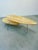 An elegant coffee table with a light, modern form inspired by late 20th-century Scandinavian design. The distinctive,...