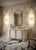 A captivating transparent color for this Murano glass wall lamp, featuring a captivating and elongated design, with a...