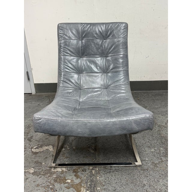 Design Plus Gallery presents the James Leather Chair from William Sonoma Home. Upholstered in grey leather, this chair has...