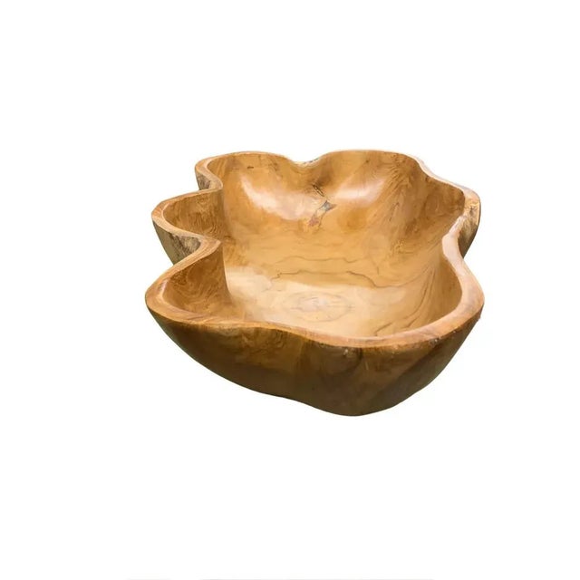 This teak live edge bowl is a unique piece showcasing the natural beauty of teak wood. Crafted by skilled artisans, its...
