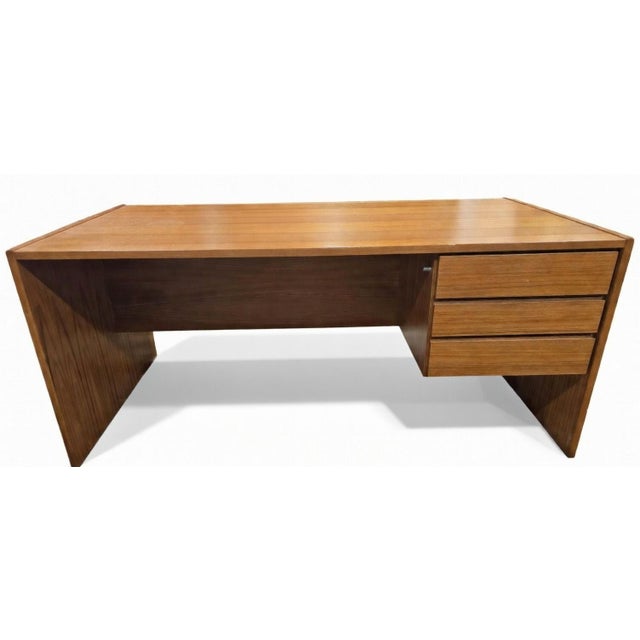 Stunning mid-century modern two-piece teak executive desk in an L-shaped configuration. This versatile desk set features a...
