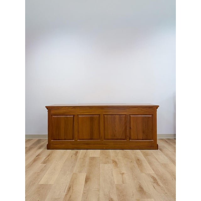 This substantial vintage antique style oak office credenza is a well-built and handsome professional storage piece. The...