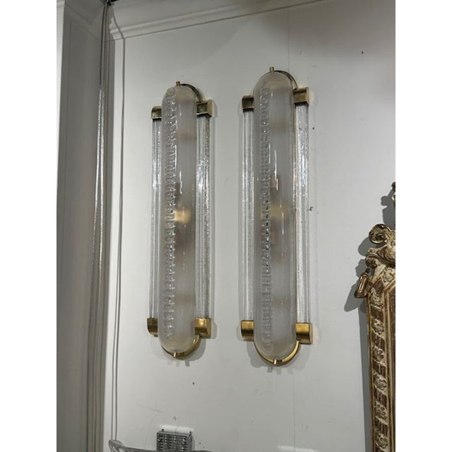 Pretty pair of Murano glass and polished brass "barber" sconces. Creates an upscale look. Very nice!