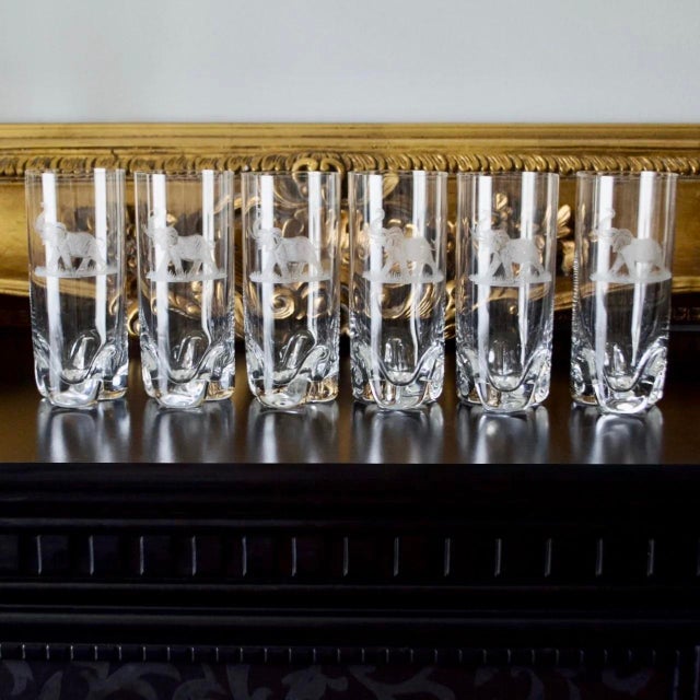 Elegant set of six Czech lead crystal tumblers featuring intricate hand-engraved elephant motifs. The detailed engraving...
