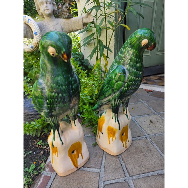 A pair of vintage large majolica roof finials in the form of parrots. Used to decorate Chinese tiled rooves.