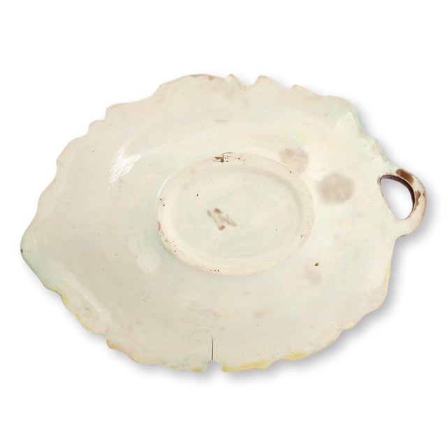 Late 19th century majolica platter modeled in the form of an oak leaf, featuring richly molded veining and naturalistic...