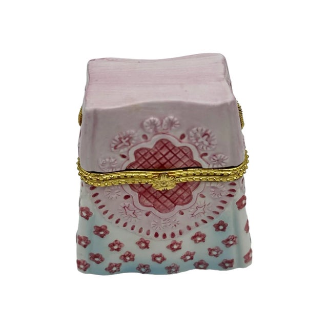 Beautiful and unique trinket box with textured flower details and a gold chain. Unmarked.