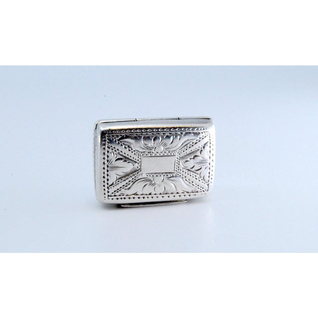 Victorian Silver and Gold Vinaigrette Box with Engravings, in Very Good conditions. Designed before 1890 This piece has an...