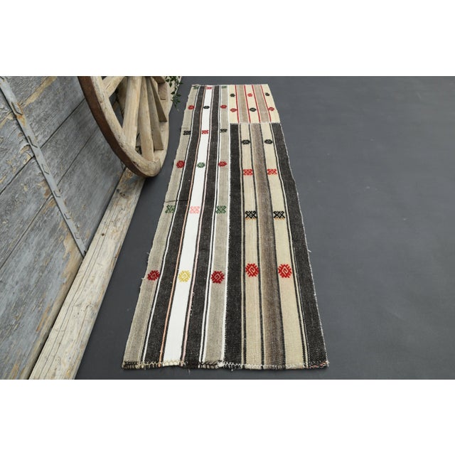 Vintage Turkish Hand-Knotted vintage rug is a semi- vintage runner rug.'70s Eastern region of Turkey's unique rug is...