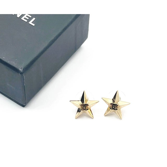 Chanel Gold CC Star Piercing Earrings *Marked 17 *Made in France *Comes with the original box, pouch and booklet...