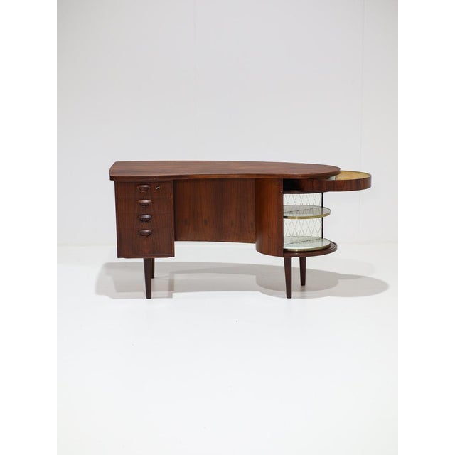 Rare kidney-shaped model 54 desk manufactured by feldballes møbelfabrik in denmark, 1960s. A unique design featuring a...