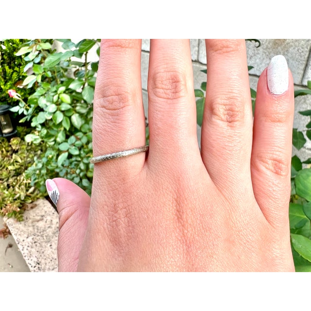 About This Ring: Make your mark with a timeless piece of history. This Art Deco Wedding Band is one-of-a-kind and sure to...