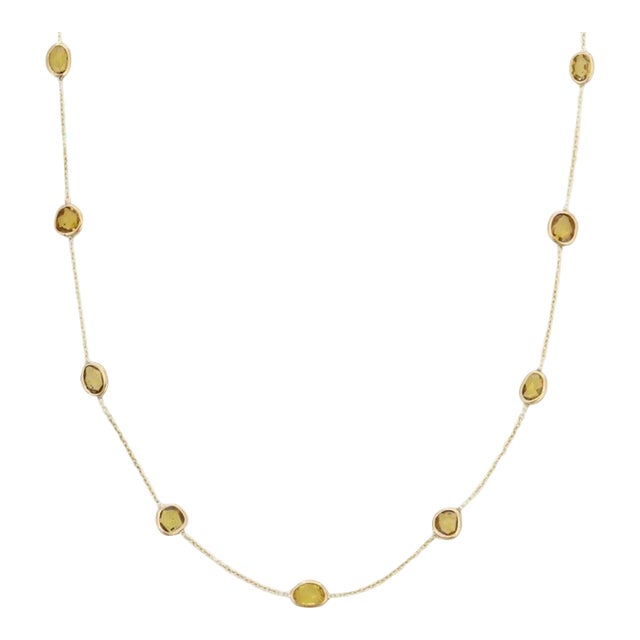 This is part of Chairish’s Fine Jewelry assortment. Yellow Sapphire Station Chain Necklace in 14K Gold studded with round...