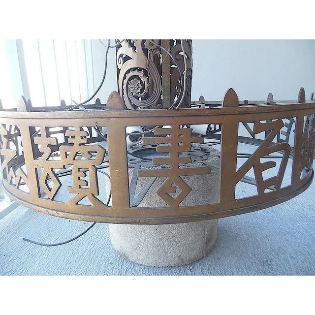 Great design & a beautiful piece of American history! This large haute design antique pierced brass chandelier features...