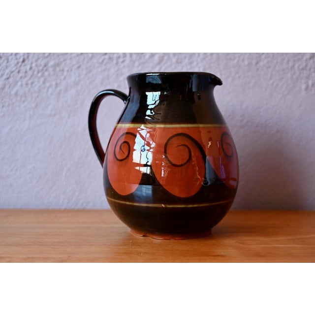 This pitcher draws its inspiration from the great traditions of handcrafted pottery and embodies the creative warmth of...