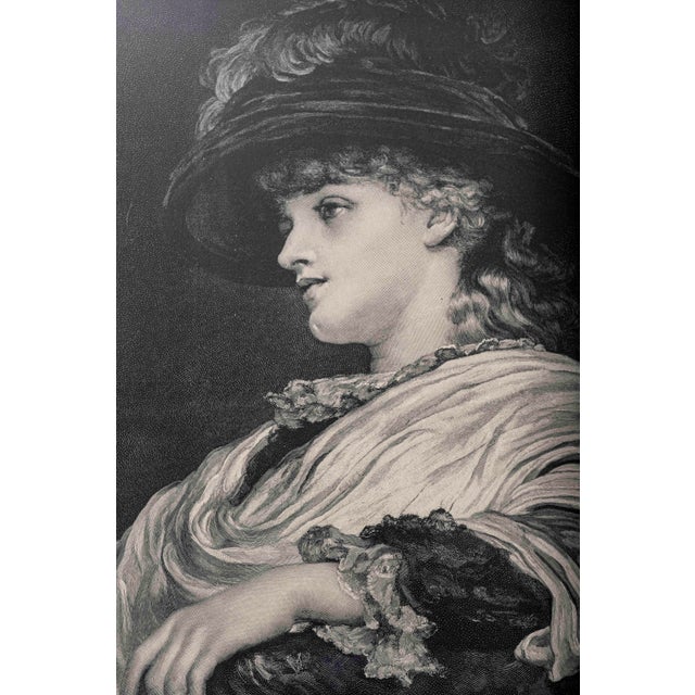 There is something quietly captivating about her, a woman caught in a moment just beyond the viewer, looking upward as if...