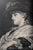 There is something quietly captivating about her, a woman caught in a moment just beyond the viewer, looking upward as if...