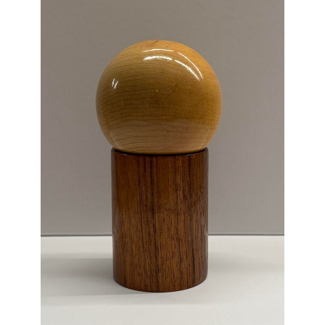 Experience Mid-Century charm with these two-tone nesting salt and pepper shakers. Crafted from solid wood, their geometric...