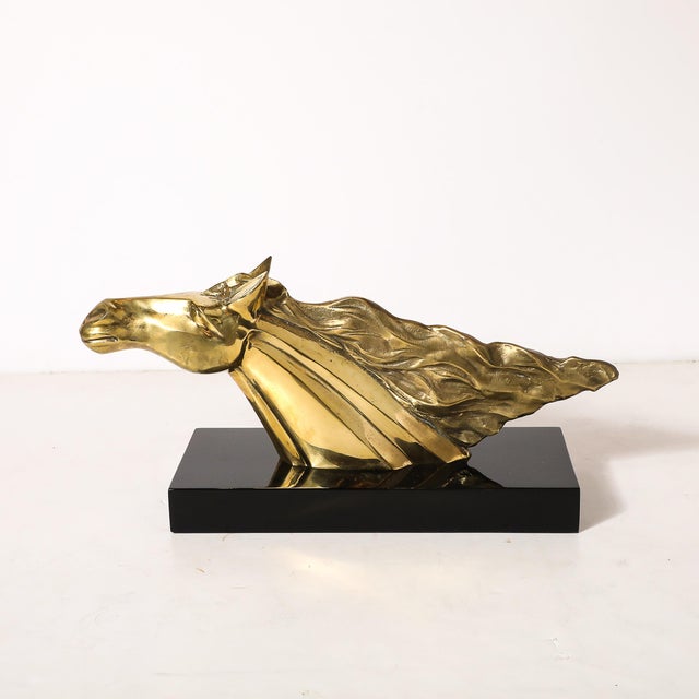 This striking Mid-Century Modernist horse bust sculpture is a dramatic representation of elegance and power. The stylized...
