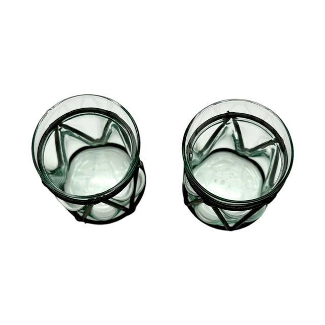 Add some vintage charm to your home decor with this beautiful pair of handmade candle holders. The asymmetrical shape of...