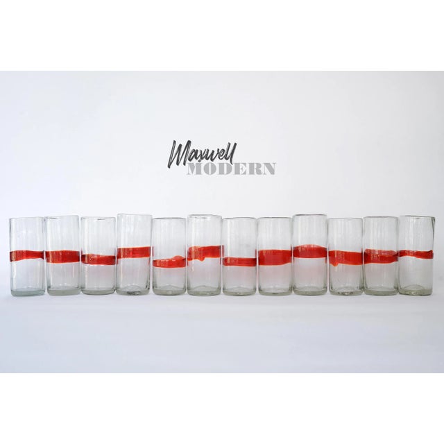 Exquisite set of 12 vintage tumblers with a striking red band from Mexico. These are perfect for the holidays especially...