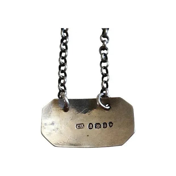 Antique English sterling silver Sherry decanter label. Six-and-a-half-inch chain (three-inch drop). Maker's mark and...