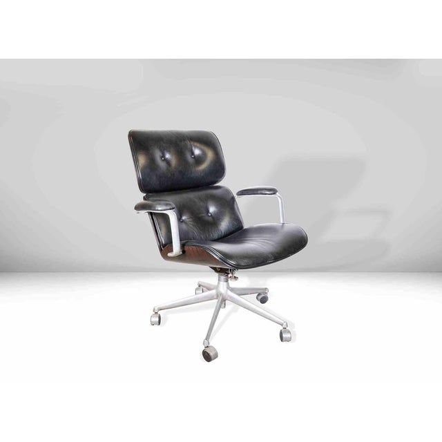 Vintage mim armchair is an original design furniture realized in the 1960s. Steel, rosewood and leather. Good condition. A...