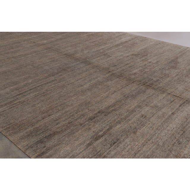 Hand-knotted in a luxurious blend of wool and silk, this monumental 15x24 rug is a rich new addition to Rug & Kilim’s...