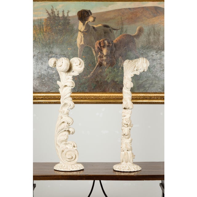 A pair of carved wooden fragments from the mid 20th century attributed to Maison Jansen, depicting scrolling foliage on...