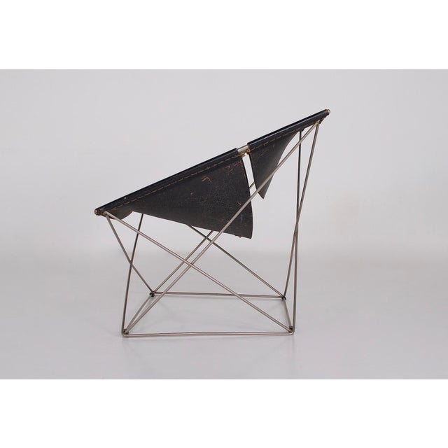Butterfly armchair f675 by pierre paulin for artifort, circa 1963, in cleaned and conditioned patinated leather, chrome...