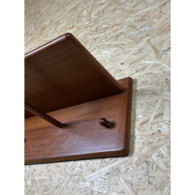 60s 70s teak wall-mounted wardrobe by Vildbjerg Møbelfabrik Denmark Object: wall coat rack Manufacturer: Vildbjerg...