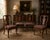 A distinguished set of four dining chairs by Kindel Furniture Company, Grand Rapids, Michigan—renowned for its high-...