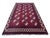 Vintage Afghan Elephant Foot rug, hand knotted in Afghanistan from 100% wool. Measuring 7’2” x 10’4”, this striking tribal...