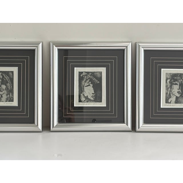Set of three black-and-white portrait prints from the Mood Study series, each depicting a woman's face with different...