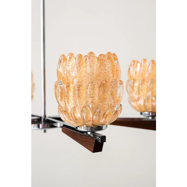 This Italian chandelier with Murano glass shades was produced in the 1960s and remains in original condition. European...