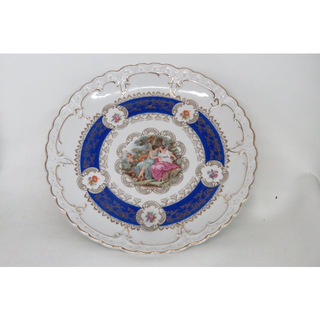 This wonderfully elegant plate is made of porcelain. This exquisite decorative plate is stamped L for Oscar Schlegelmilch,...