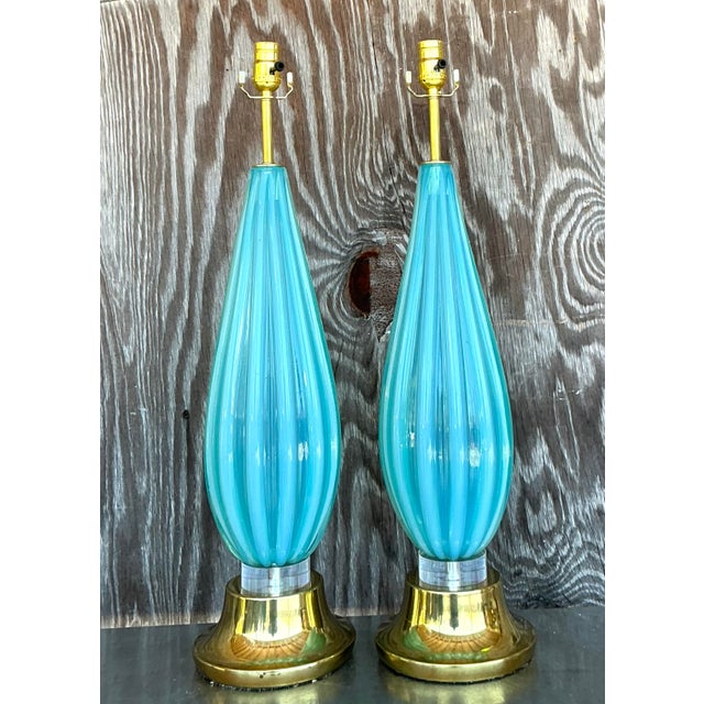 Illuminate your space with the captivating beauty of this pair of vintage Italian glass lamps, crafted in the exquisite...