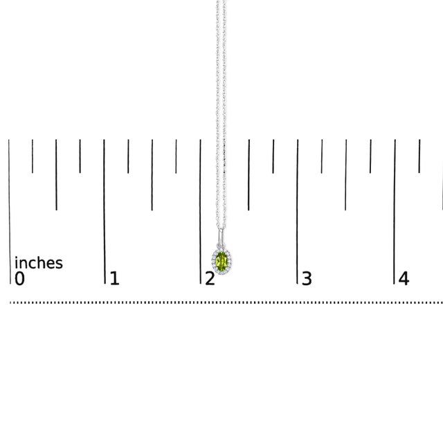 Early 21st Century 10K White Gold 5x3mm Green Peridot and Diamond Accent Halo Oval Shape 18" Pendant Necklace (I-J Color, I1-I2 Clarity) For Sale - Image 5 of 5