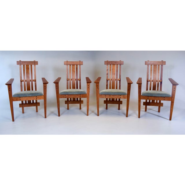 Arts & Crafts inspired pair of Douglas Green for Green Furniture Design armchairs, executed in cherry wood of impressive...