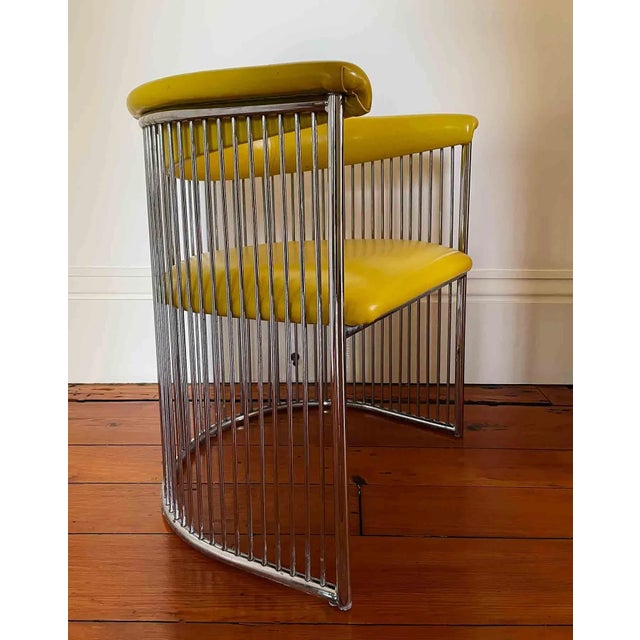 Mid century wire chrome curved armchair with vinyl seat and rounded backrest which lifts off. Expressive and sculptural...