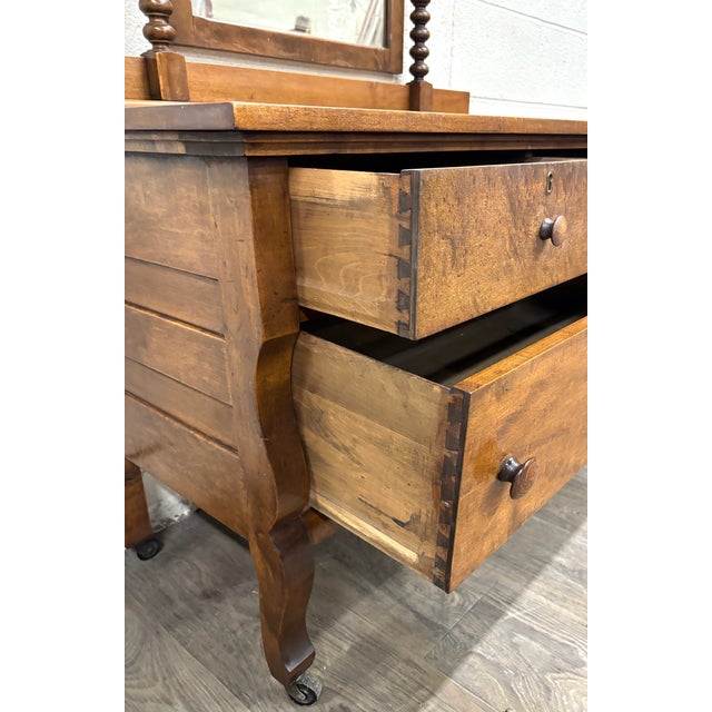 This is a gorgeous antique American Victorian dresser with a tall removable mirror, circa 1870–1890. Features beautiful...