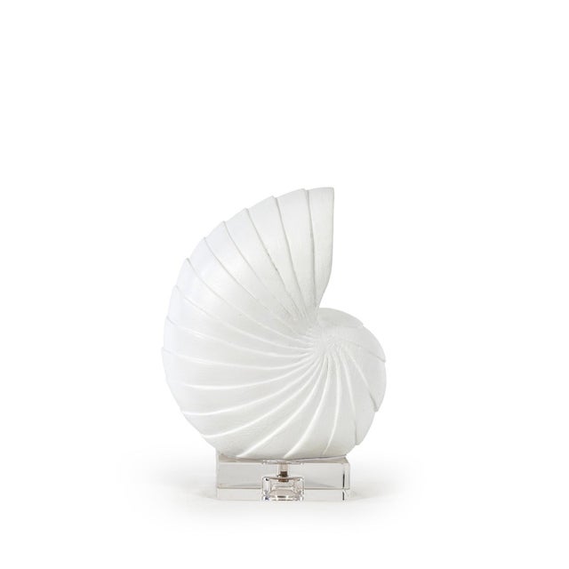 An abstract interpretation of the iconic nautilus spiral, the small Nautilus Shell Sculpture is crafted in a cast...