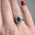 A stunning and timeless French daisy cluster ring (circa 1990), crafted in 18k white gold. This exquisite piece features a...