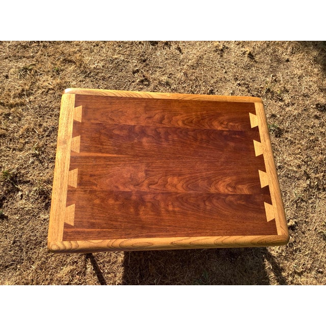 A lovely vintage Lane 900-05 ash and walnut side table. The table top has scratches, and scuff marks. There is a small...