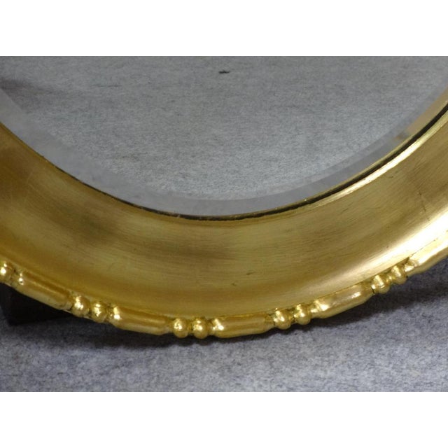 Can be hung portrait or landscape, a nice Edwardian antique gilt mirror with original beveled edge place, which has very...