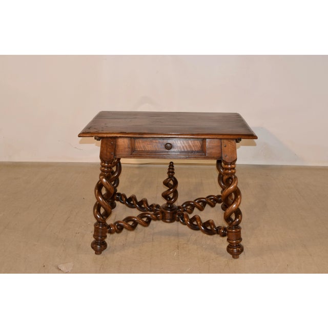 Fabulous 19th century walnut side table from France with a beveled edge around the top, following down to a simple apron...