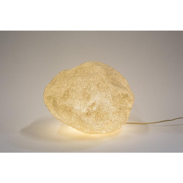 The lamp offered dates from around the 1970s and was manufactured by Singleton in Italy. The body is made of translucent...